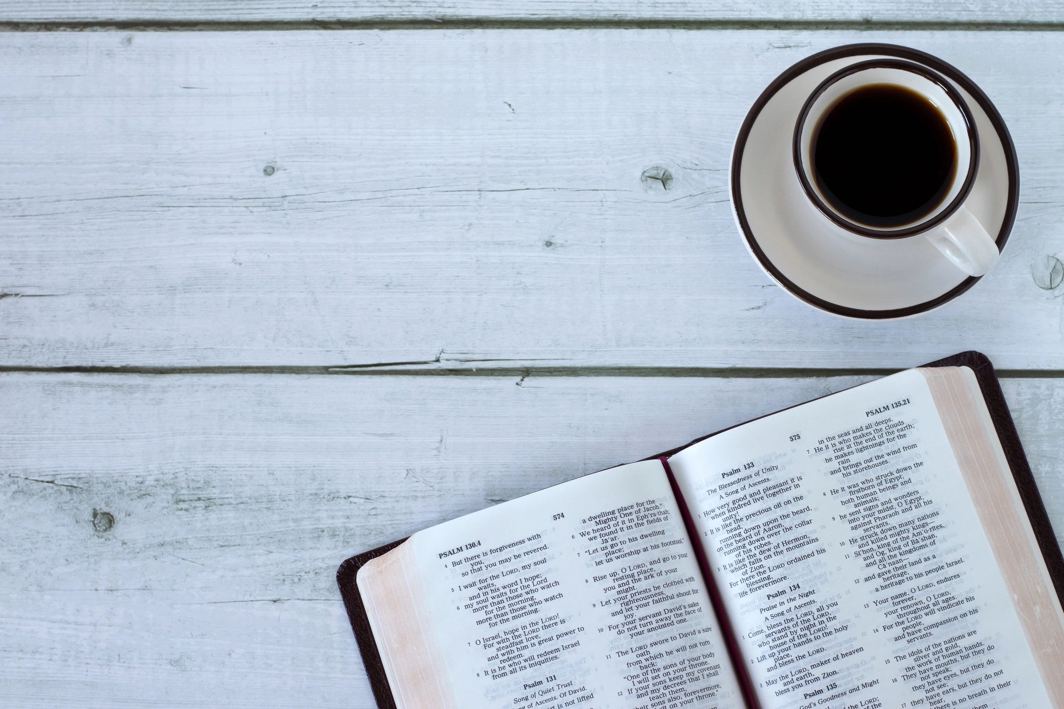 open bible with coffee