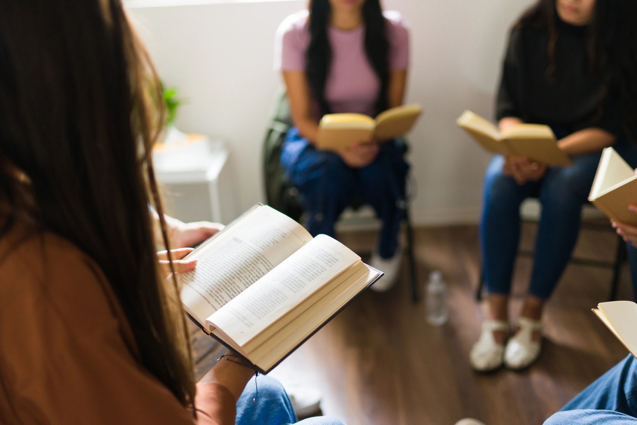 women reading book club discussion